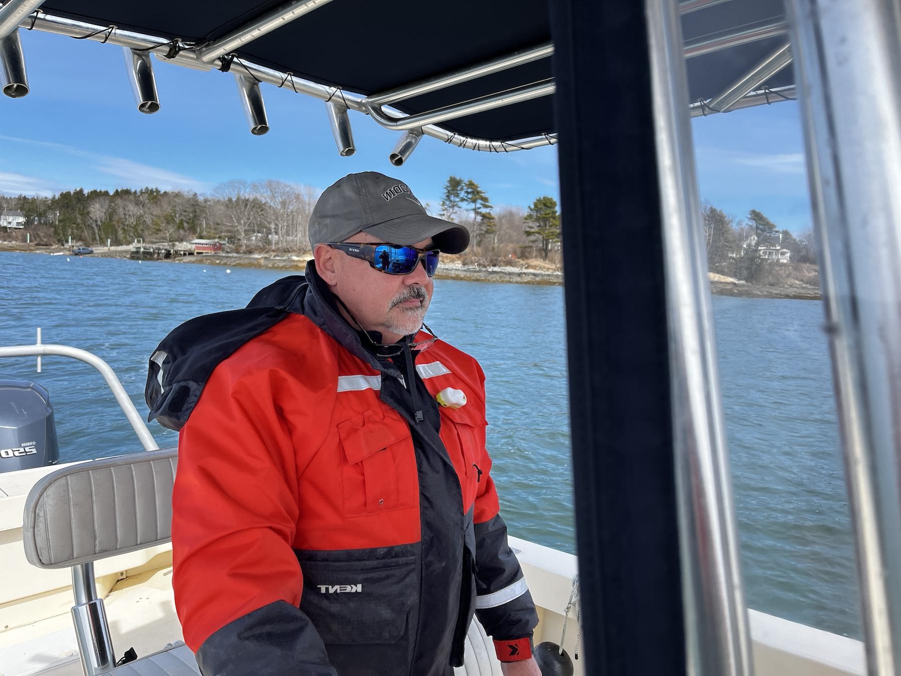 Clint Thompson driving a boat